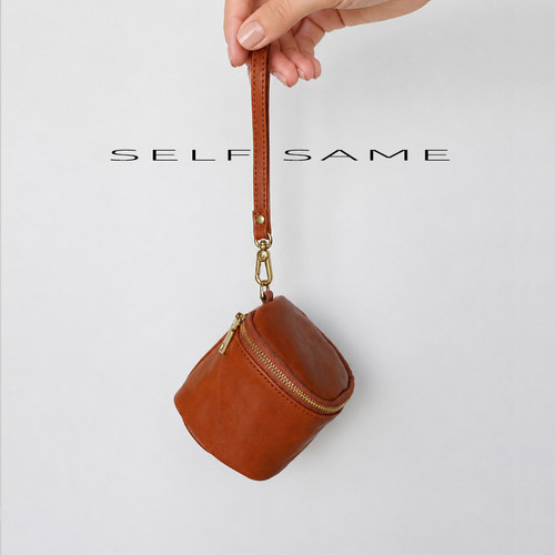 SELFSAME 植鞣牛皮圆筒手腕收纳包 可拆卸挂扣小物包耳机零钱袋