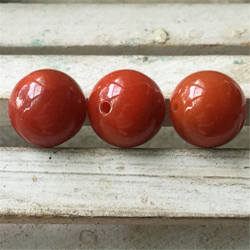 凉山柿子红火焰纹玛瑙圆珠