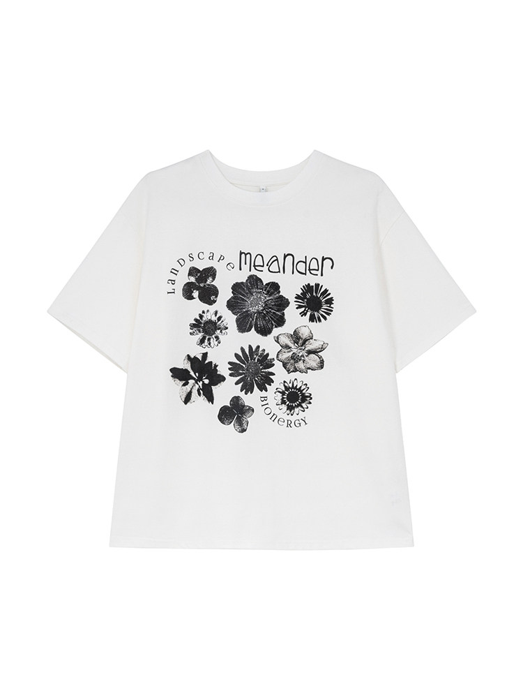White graphic T-shirt with black floral print and text