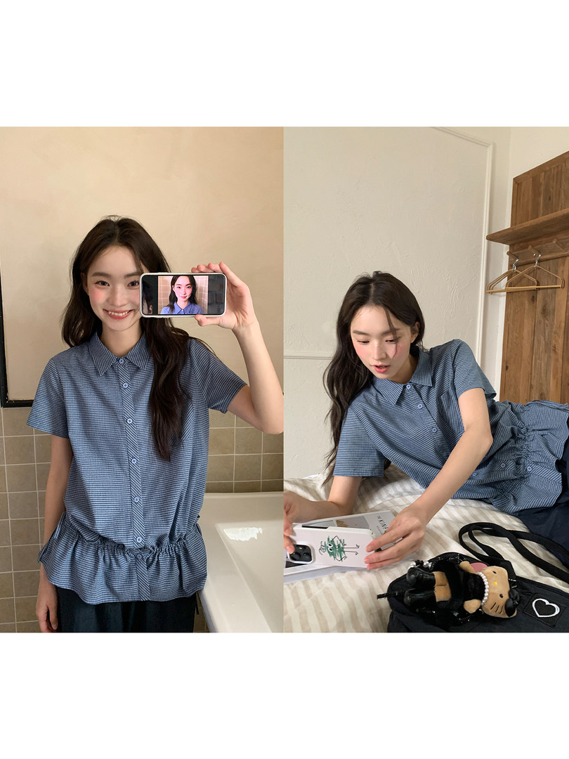Blue check short-sleeve button-up shirt worn by a model