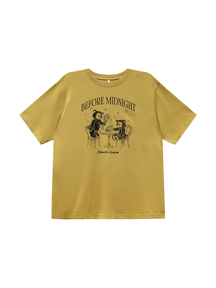 Mustard yellow graphic T-shirt laid flat with 'Before Midnight' print