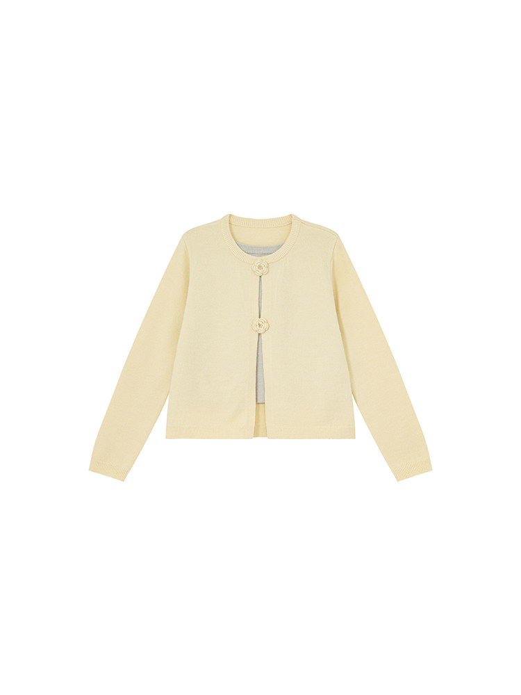 Light yellow long-sleeve cardigan with front button closures on a white background