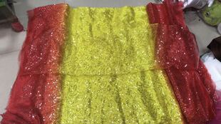 渐变色舞蹈服装面料.大红渐变黄色迷宫亮片欧根纱布料.亮片纱面料