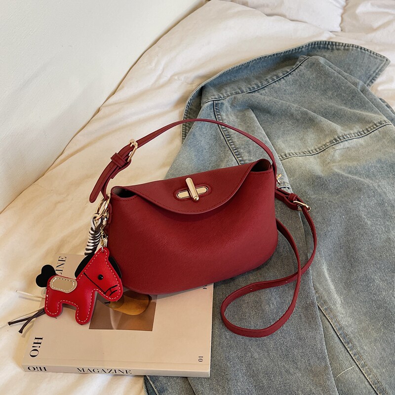 精致洋气红色小元宝包女2026春新款时尚单肩斜挎包百搭手提饺子包