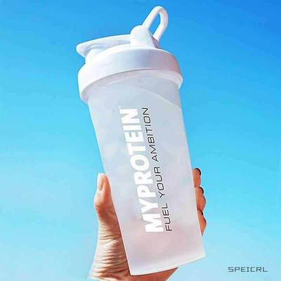 Glass stirring a cup of milk shake shake cup protein powder