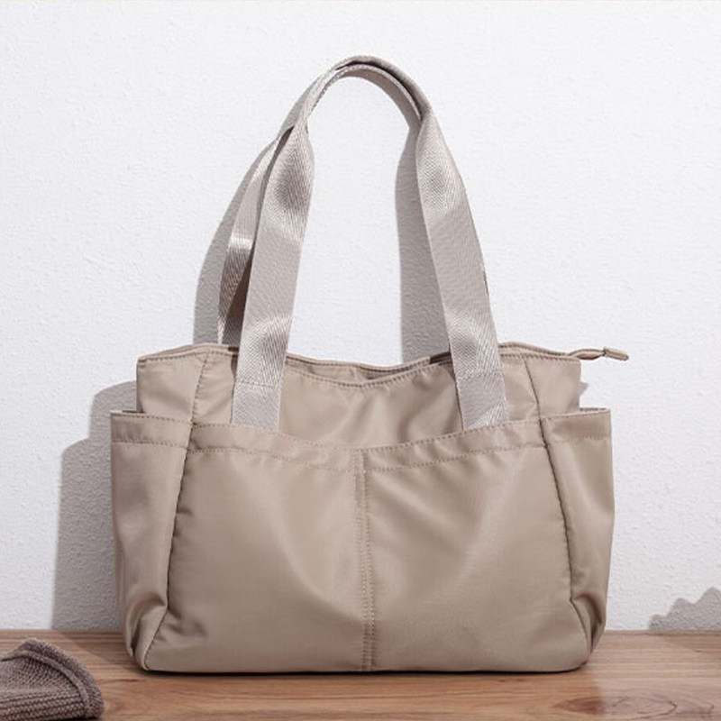 大容量防水女包纯色手提托特包复古手拎包休闲单肩挎包上班多袋包