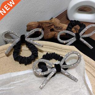South Kore's Dongdemun Shiny dimond-studded bow hir ring