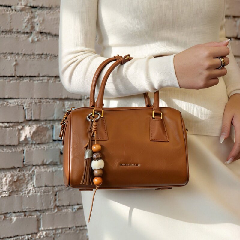 欧米OMI女包2025新款休闲牛皮保龄球包手提包百搭通勤单肩斜挎包