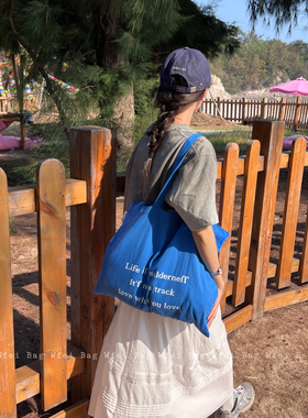 新款春夏韩系小众蓝色帆布袋小清新字母印花大容量百搭薄款单肩包