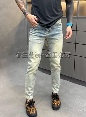 设计款泥黄水洗做旧牛仔裤男修身