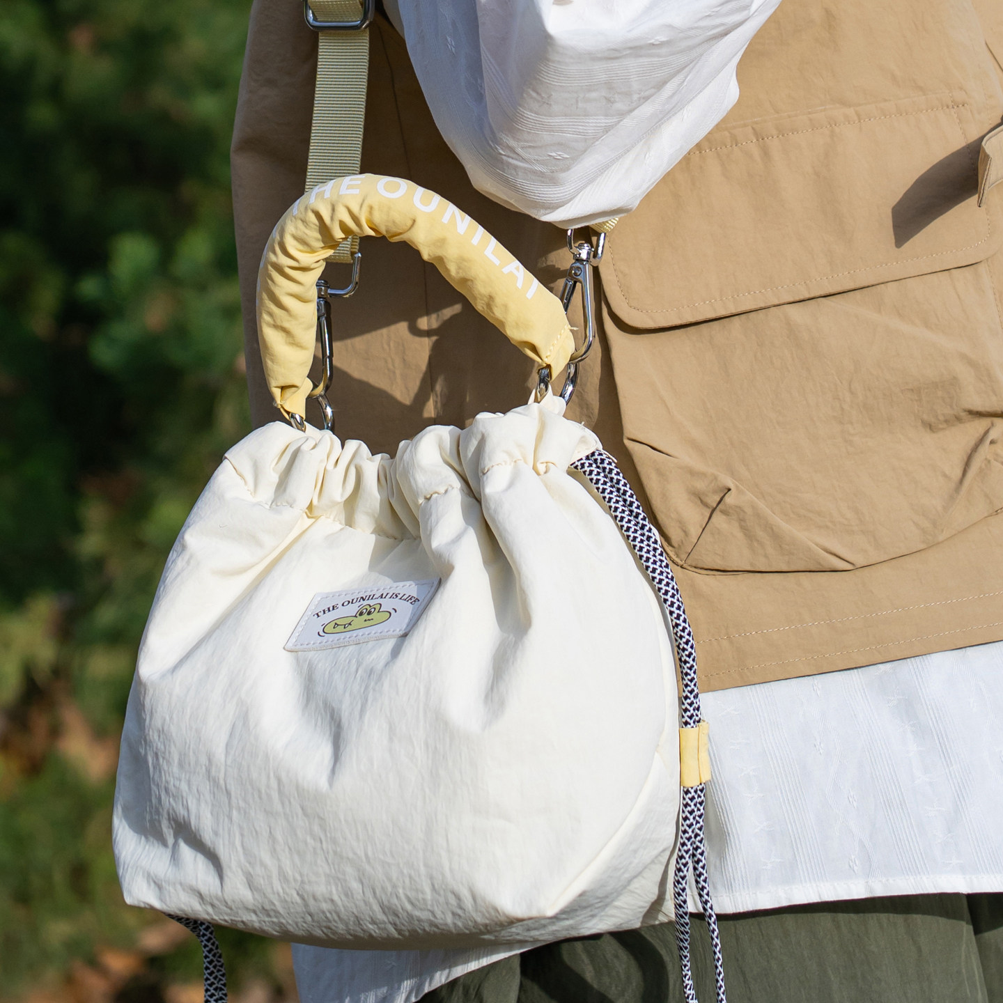 日系文艺单肩微单相机包女生斜挎包手提摄影包便携出游抽绳水桶包