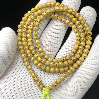 原生态鸡油黄星月菩提包浆玉化正圆星月菩提108颗陈籽圆珠海南