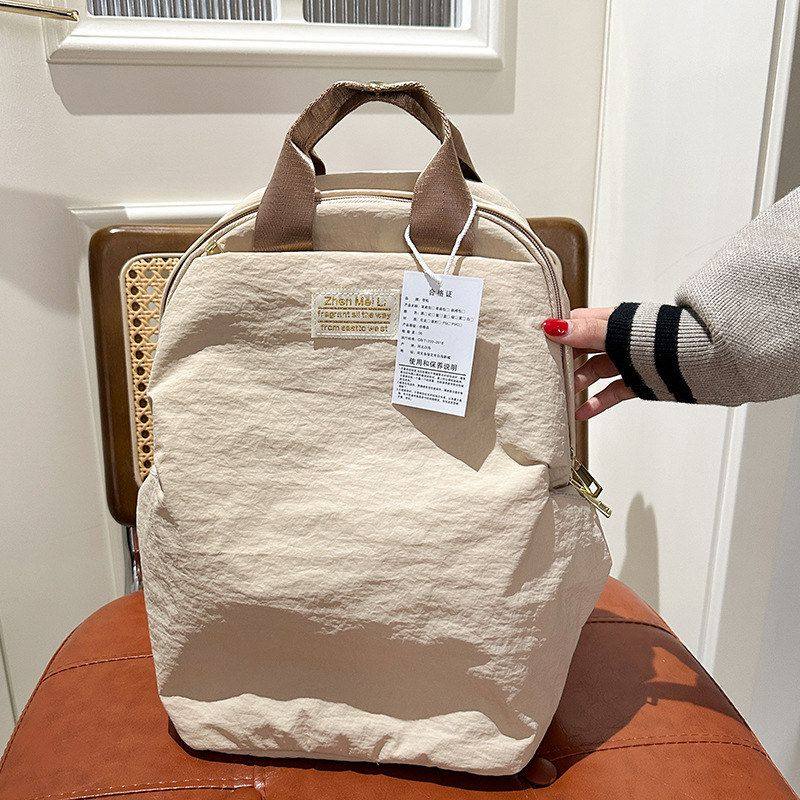 日常通勤双肩包休闲简约旅行包百搭纯色大学生书包轻便出行背包