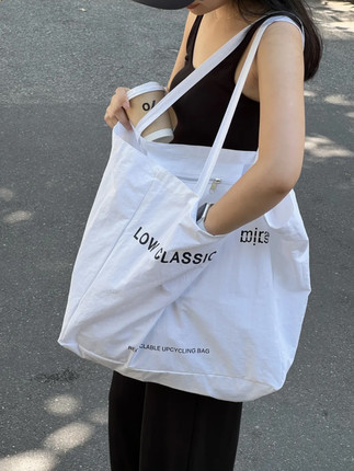 章若楠同款白色字母帆布包2025春夏新款韩系小众单肩包通勤托特包