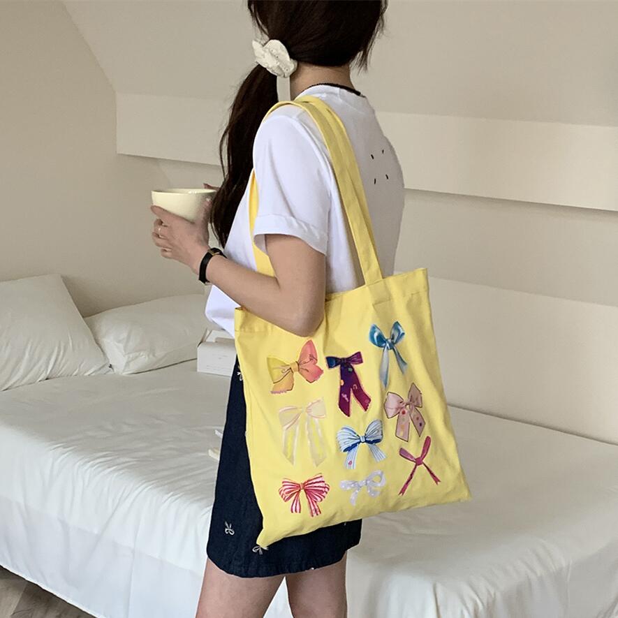 韩系彩色蝴蝶结单肩包春夏新款亮眼显白帆布包大容量高颜值购物袋