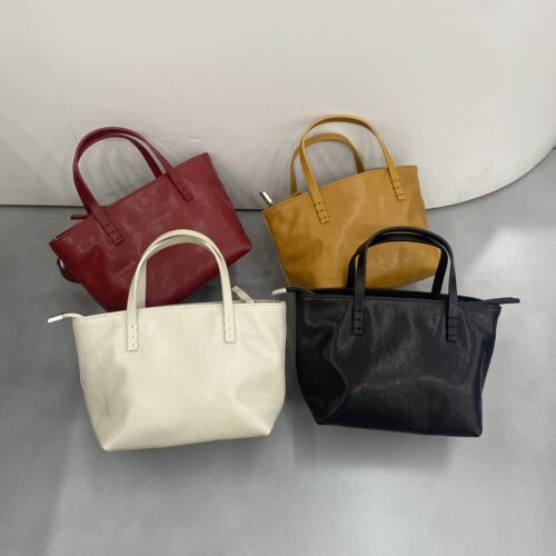 真皮新款女包时尚百搭手提单肩斜挎包流行包腋下包小包水桶包