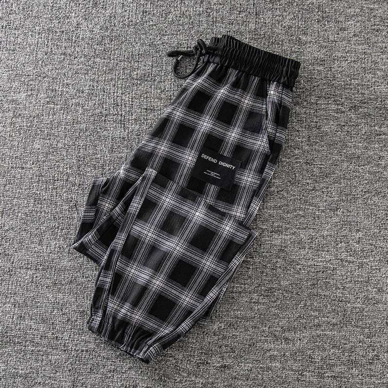 潮牌黑白格子束脚休闲裤女2025秋冬季新款宽松加绒显瘦格纹哈伦裤