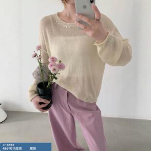 春装女款2026年新款白色卷边领显瘦独特漂亮薄款针织衫上衣女长袖