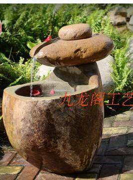 天然鹅卵石打造石磨水桶流水鱼缸复古自然石桶来运转水景庭院景观