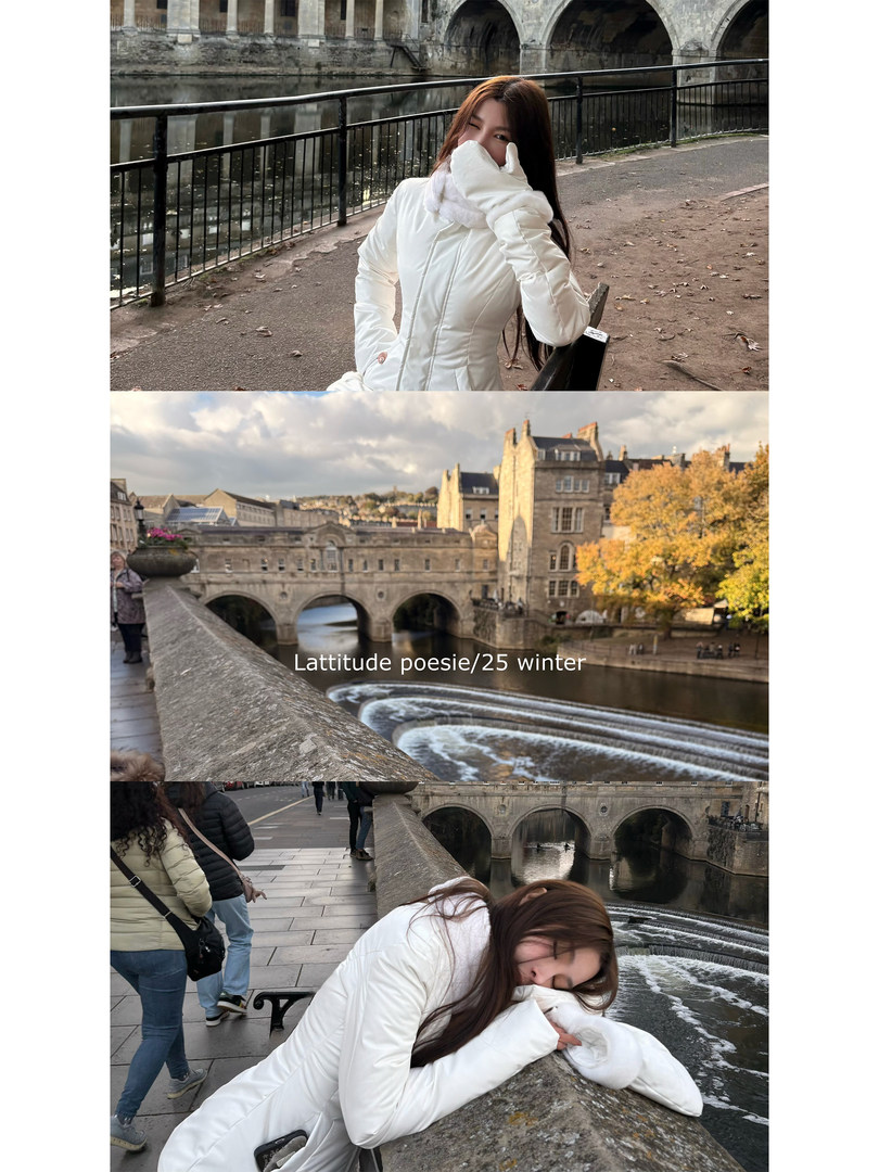 White winter coat worn by a woman in an outdoor riverside setting