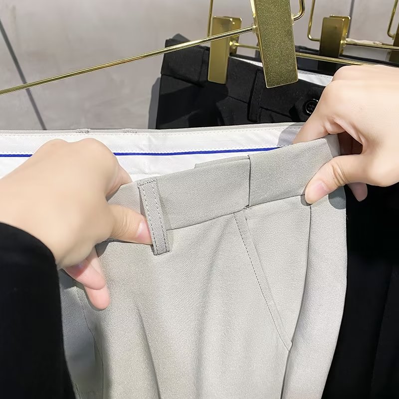 夏季便捷式隐藏松紧腰男士西裤英伦风免烫修身净色薄款9九分裤子