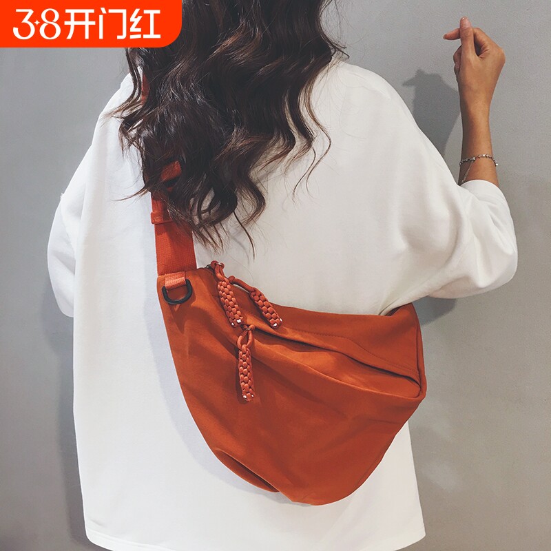 简约帆布包女2025新款户外运动旅游防水轻便大容量胸包通勤斜挎包