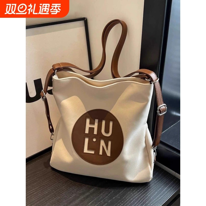 金玉鸟帆布包女新款时尚大容量多用双肩包学生上课通勤斜挎托特包