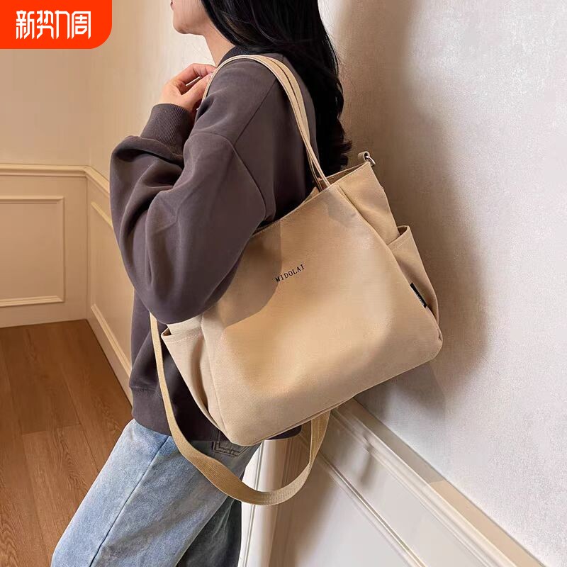 大容量帆布包2025新款单肩包卡通精致高级感手提学生上课通勤托特