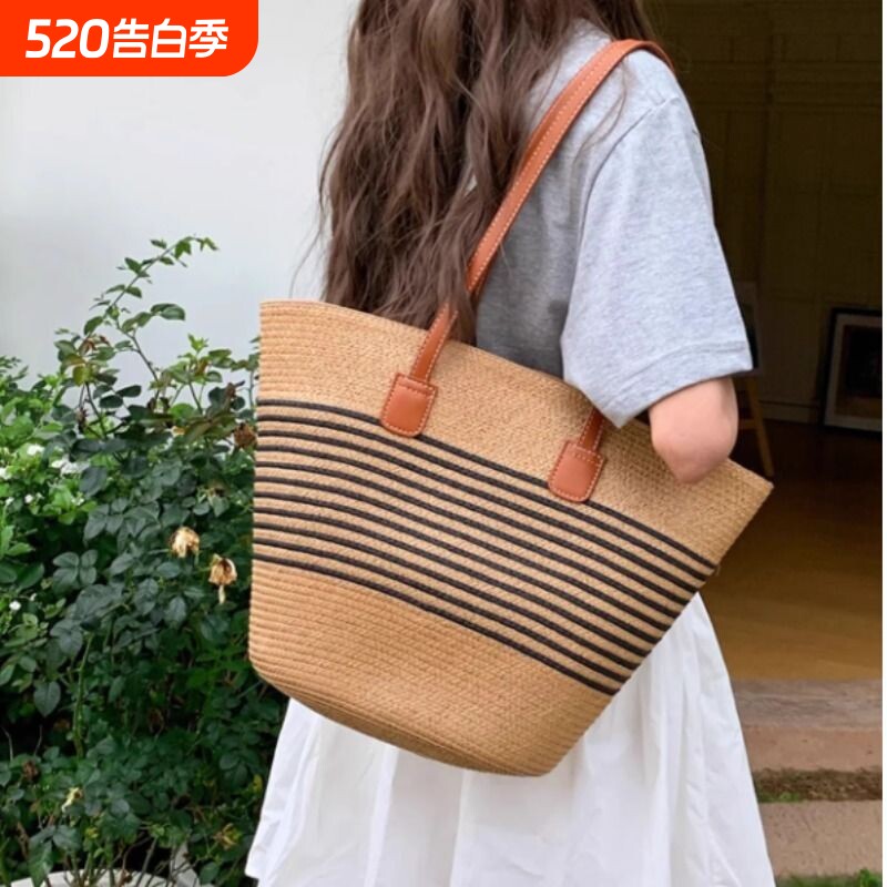 海边度假沙滩包包女2025新款夏季编织单肩包大容量腋下草编水桶包