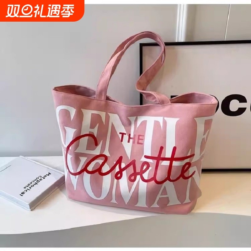 韩国小众帆布包包女2025新款时尚大容量手提袋字母单肩上课托特包