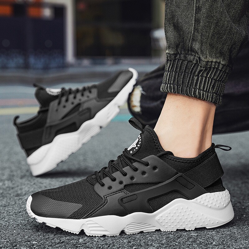 足力正健秋季华莱士透气网面休闲百搭运动鞋男鞋跑步鞋7773黑色