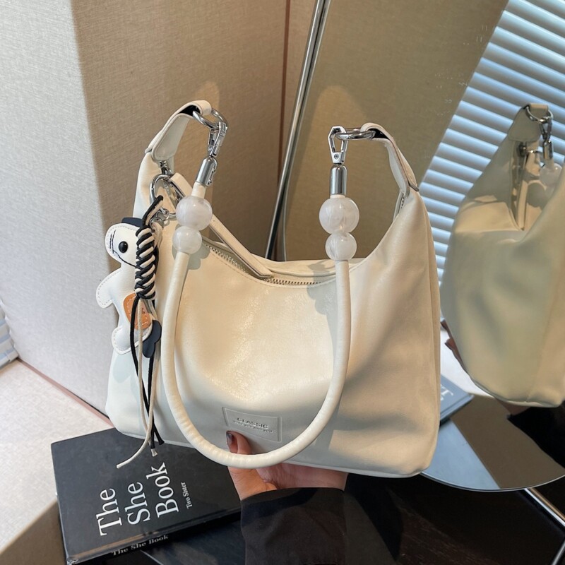 今年爆款包包女2026新款简约单肩腋下包休闲大容量通勤斜挎饺子包