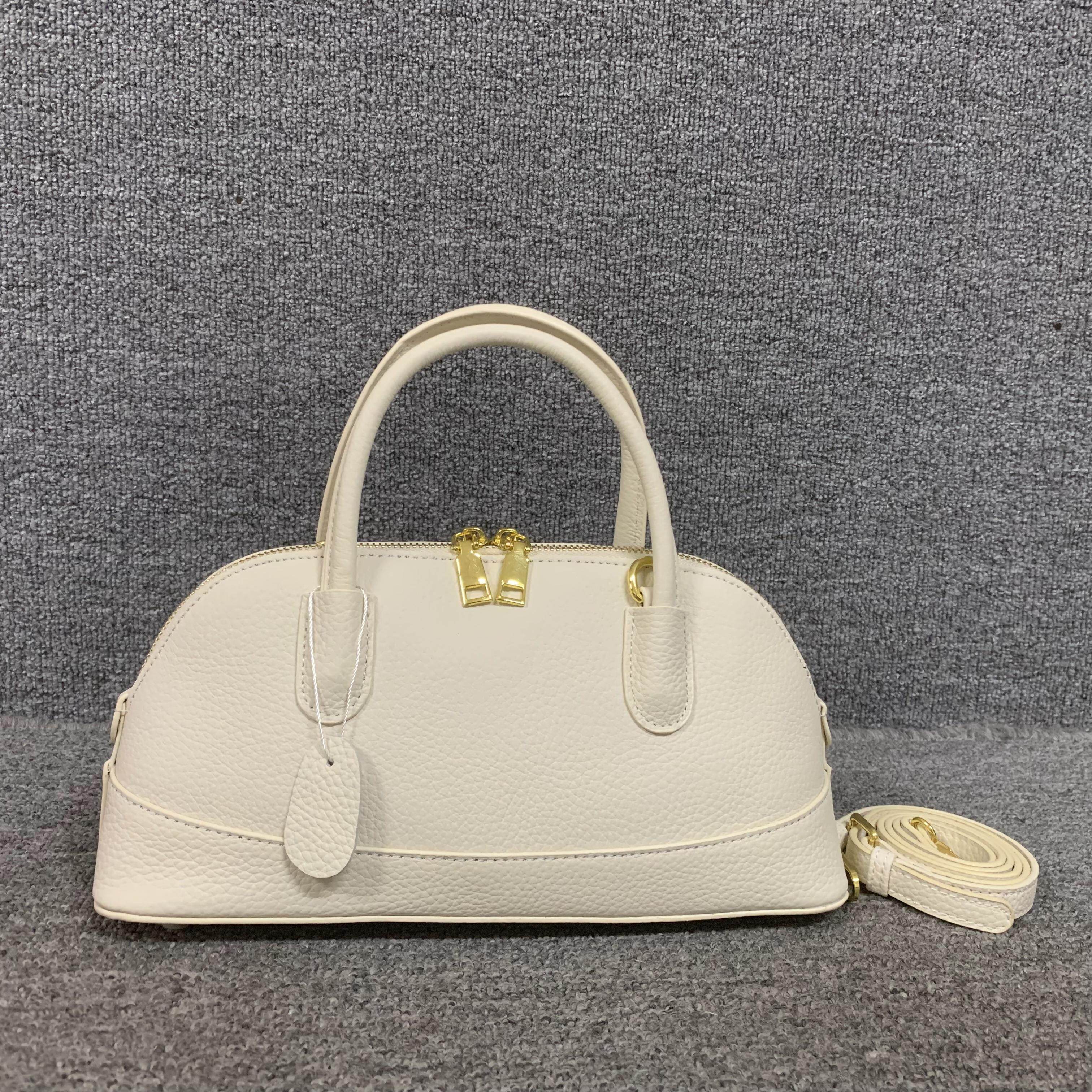 商场捡漏~~真皮女包韩版百搭时尚头层牛皮女手提单肩简约贝壳包女