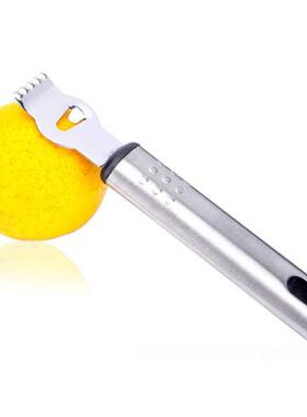 Zester tenu dans la main de citron d	acier inoxydable d&#