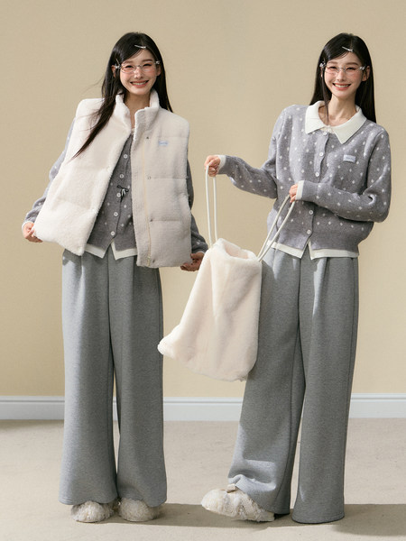 Two women modeling gray loungewear sets with a white fleece vest and matching tote bag