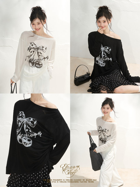 Model wearing an off-shoulder graphic long-sleeve top in black and white