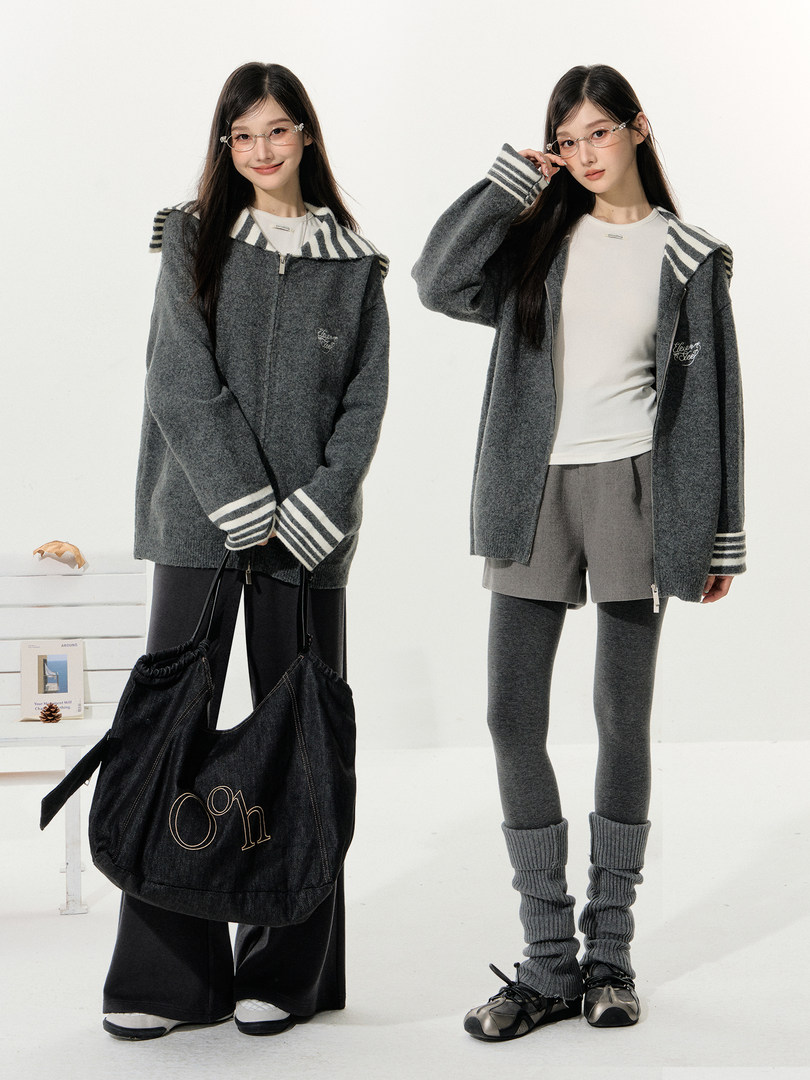 Gray zip-up hooded cardigan worn by two models with striped trim and matching casual bottoms