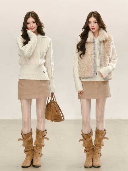 Two women modeling a winter outfit with cream knit sweaters, faux fur vest, skirt, tights, boots, and a handbag