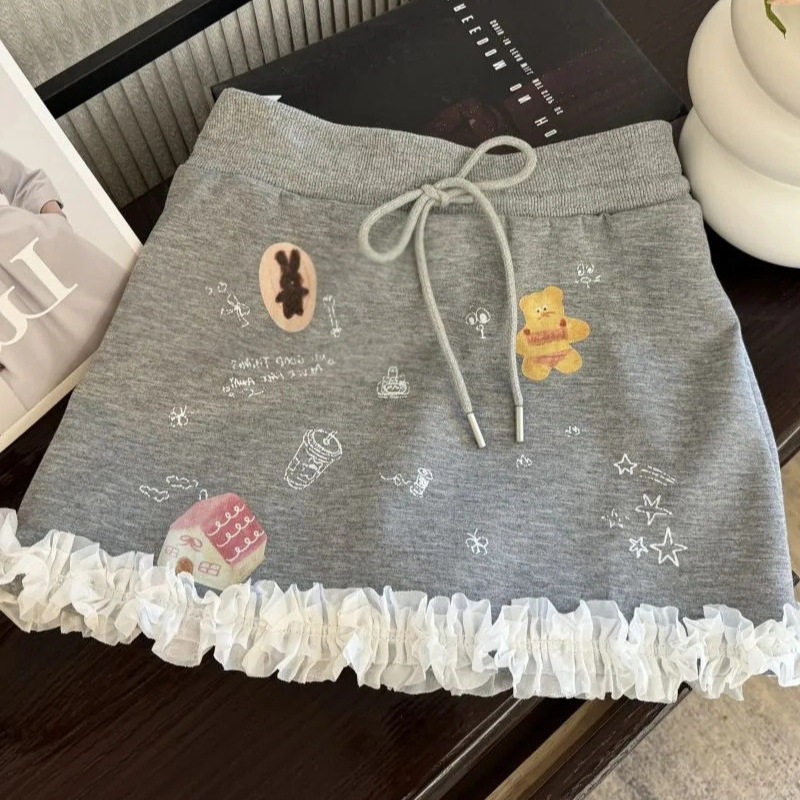 韩系甜美涂鸦蕾丝拼接半身裙女小半身裙