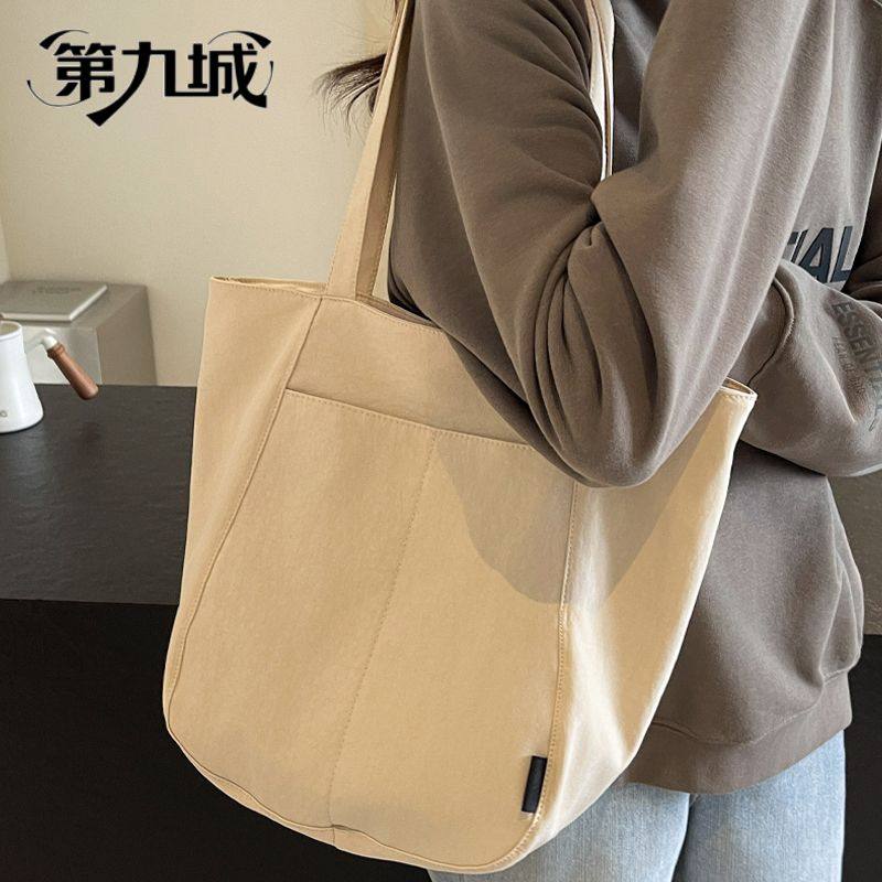 第九城帆布包包女2026新款潮时尚通勤女包大容量手提袋单肩托特包,箱包皮具/热销女包/男包,单肩包,淘宝优惠券,粉丝福利购,淘宝优惠卷