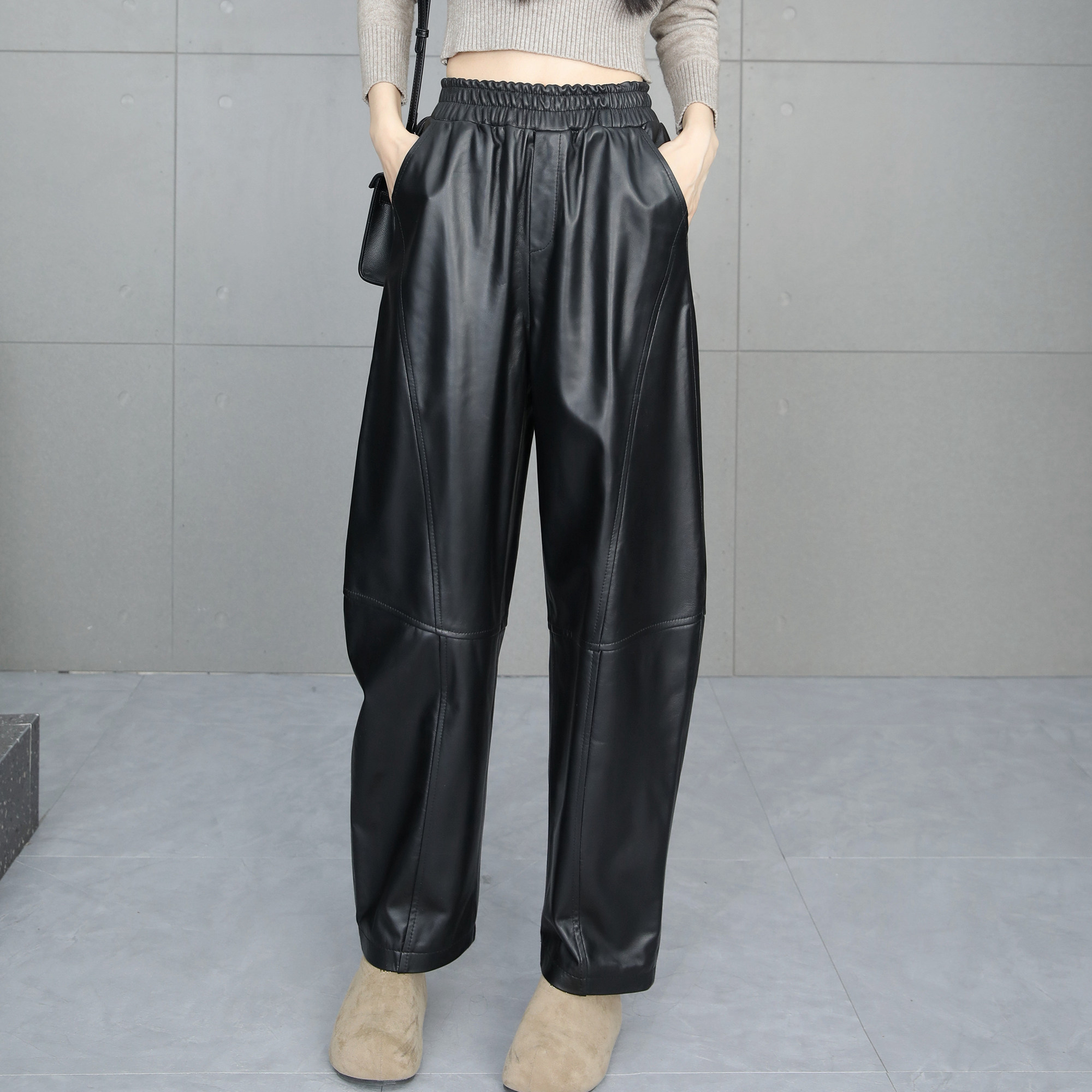 弯刀裤女2025年冬季新款真皮黑色