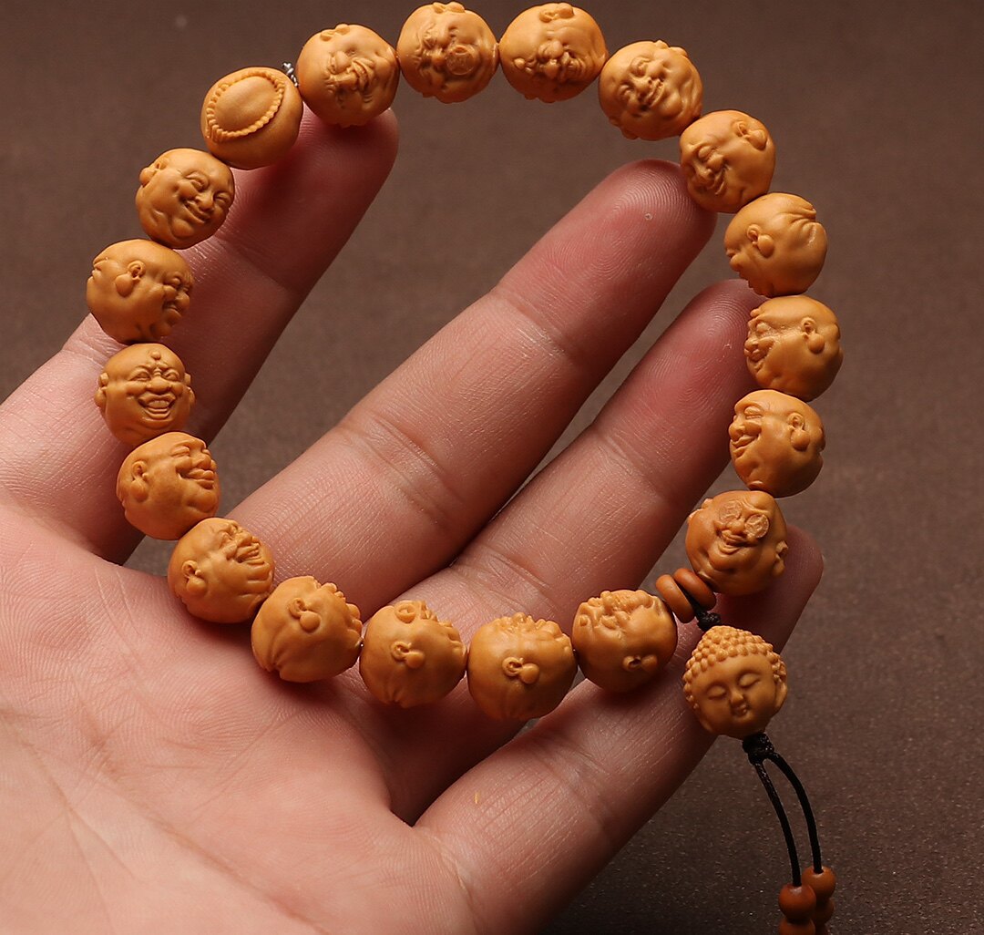姜黄皮龙纹桃核人生百态喜怒哀乐小籽桃核雕刻文玩手串手持开心