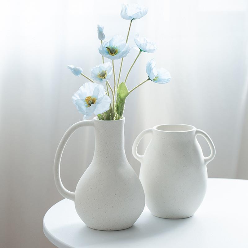 Ancient silent INS with a white-coloured flower decorated li