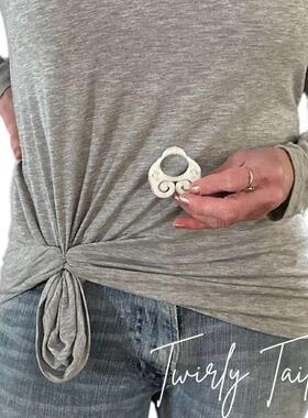 A lady tied to a beautiful girls button and buttoned to a c