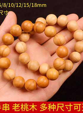 Peach wood hand to a man and a woman with a deep-coloured cy