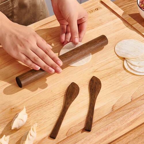 Picking a spoonful of chicken winged wood dumplings and digg
