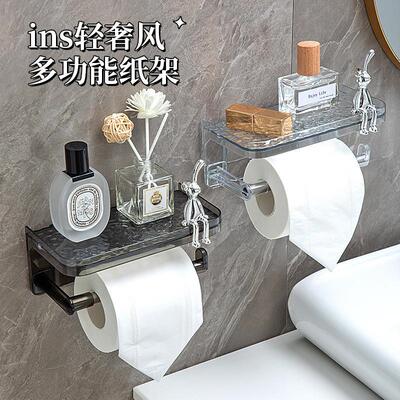 Toilet paper box rolls and towel hangers placed on paper can