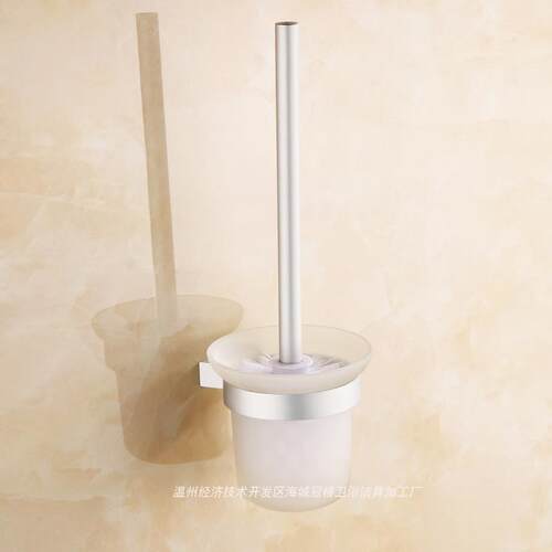 Toilet toilet brush a glass bathroom shelf with a towel rack