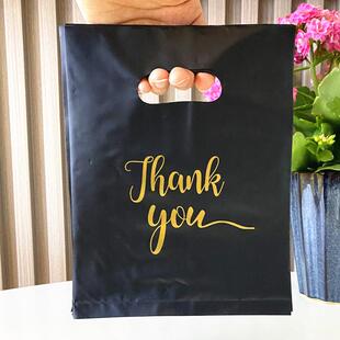 Four fingers with a plastic bag and a thick gift bag in a bl