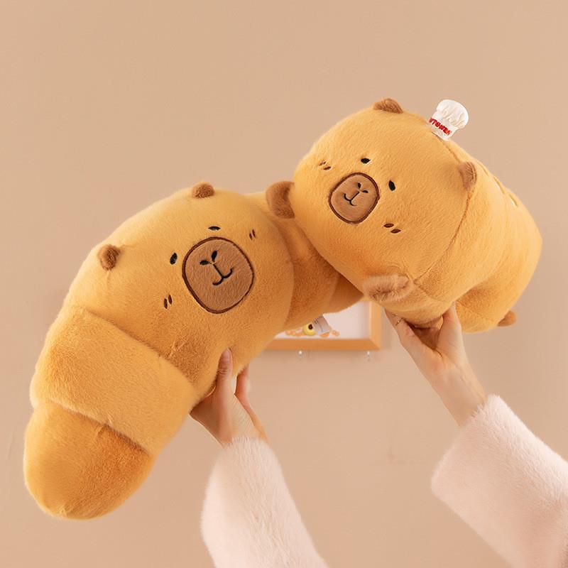 Dolphin Kapybara, sleeping in bed with long-legged dolls wit